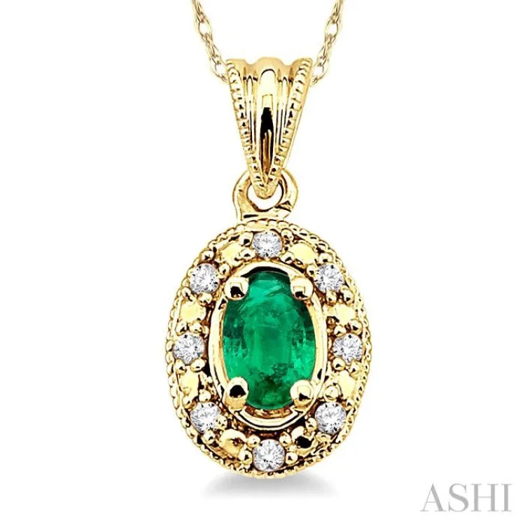 5x3mm Oval Shape Emerald and 1/20 Ctw Single Cut Diamond Pendant in 10K Yellow Gold with Chain.